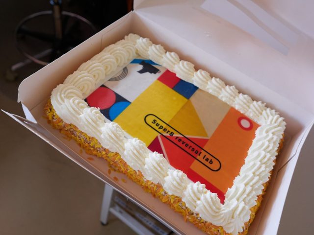 Delicious cake with logo.